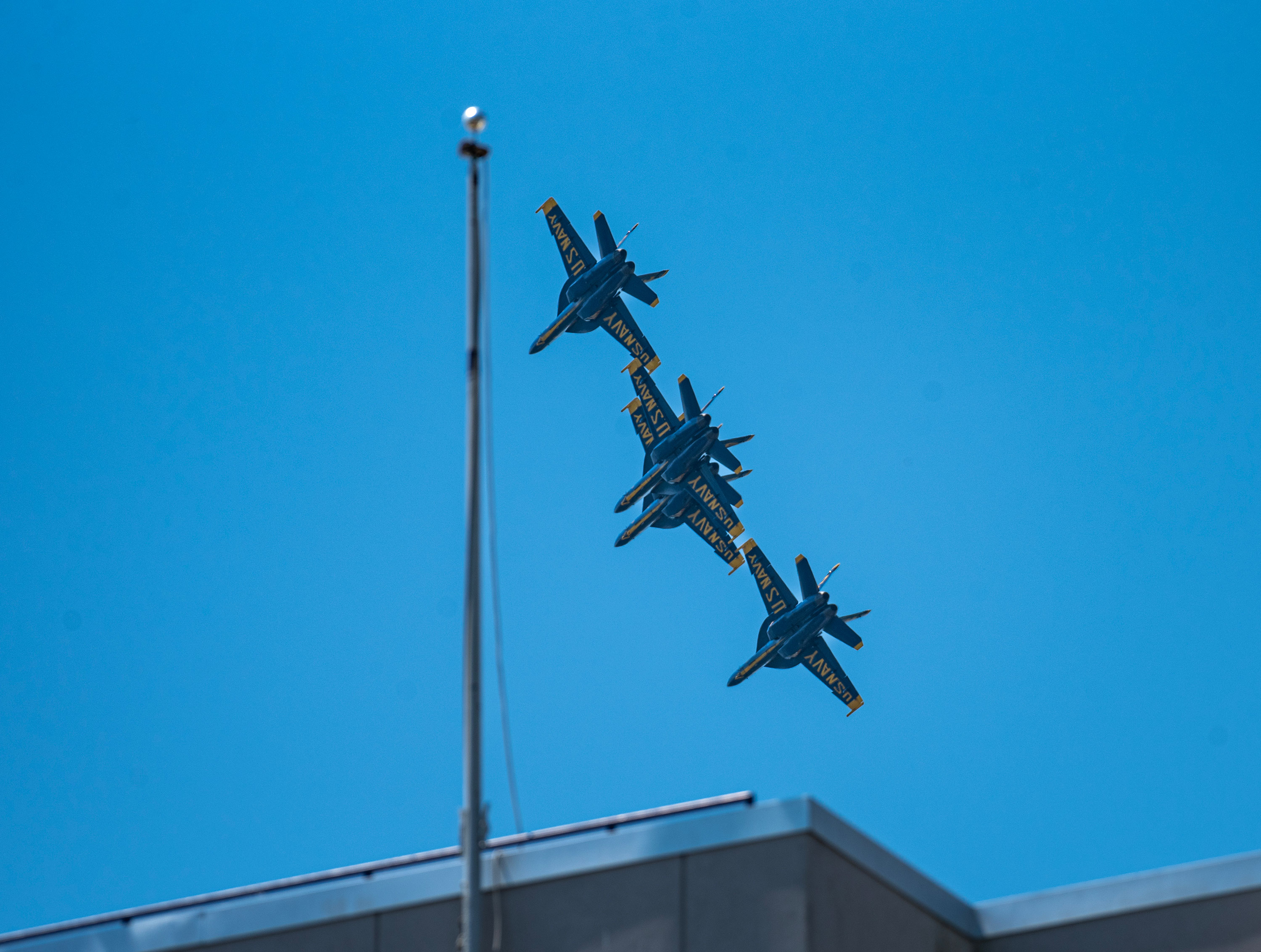 Close up of jets in formation flying over Navy Stadium