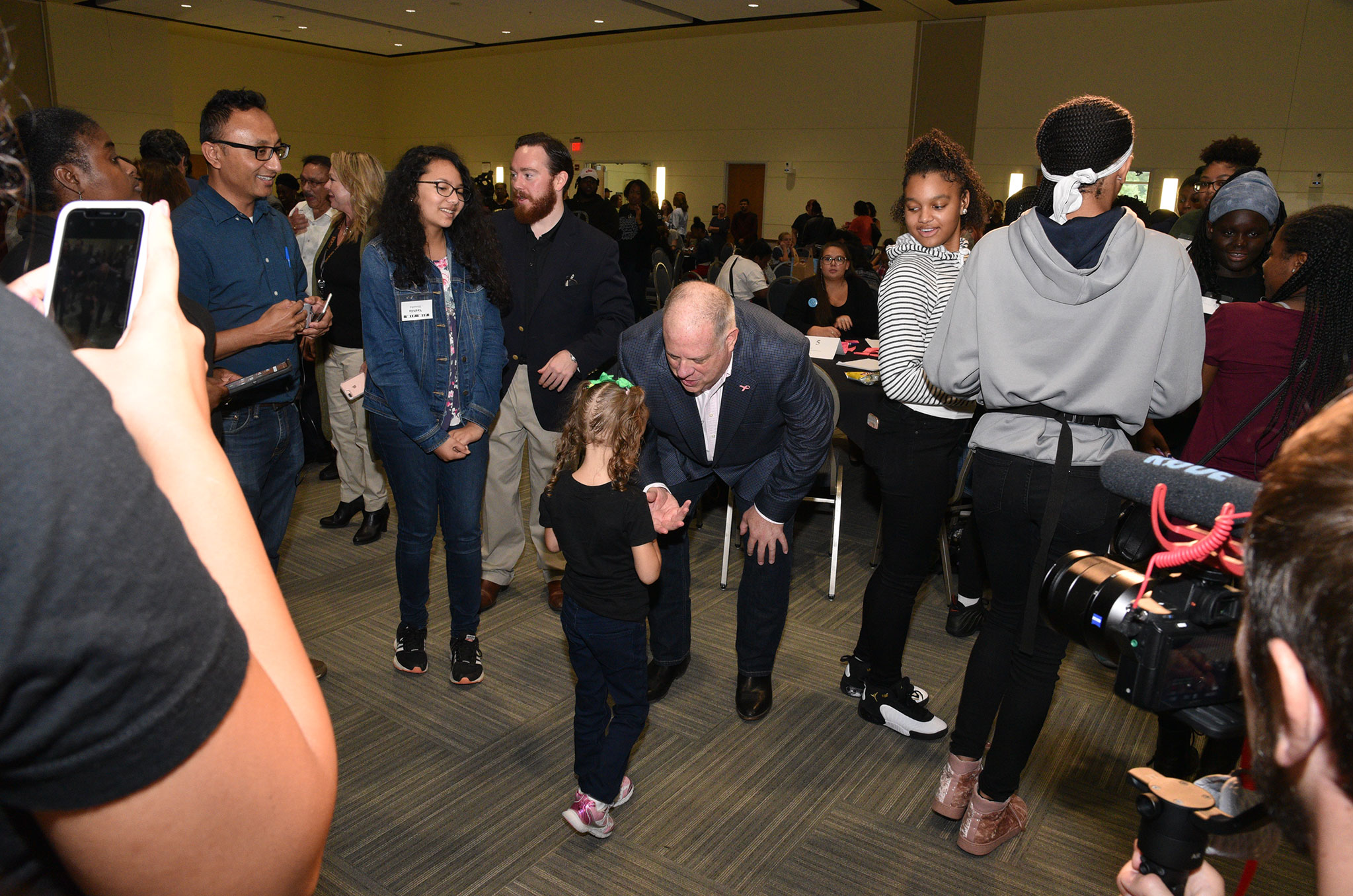 Governor Hogan speaking to a girl at Girls Who Code event