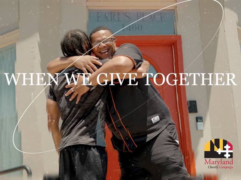 Clip from the video showing a mentor hugging his mentee