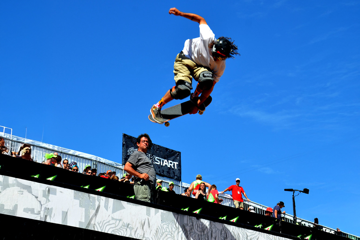 skater flying along the top of the halfpipe