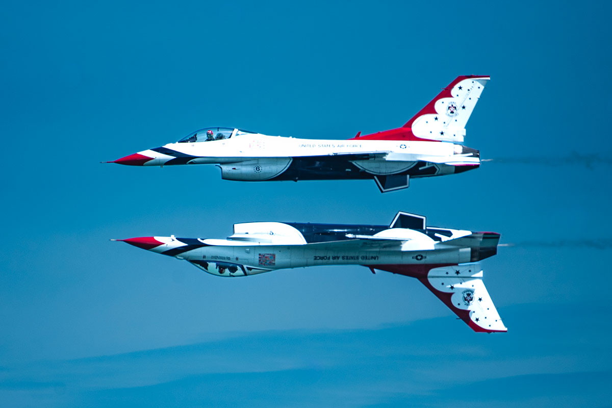 two jets, one on top of the other, one upright, the other upsidedown.