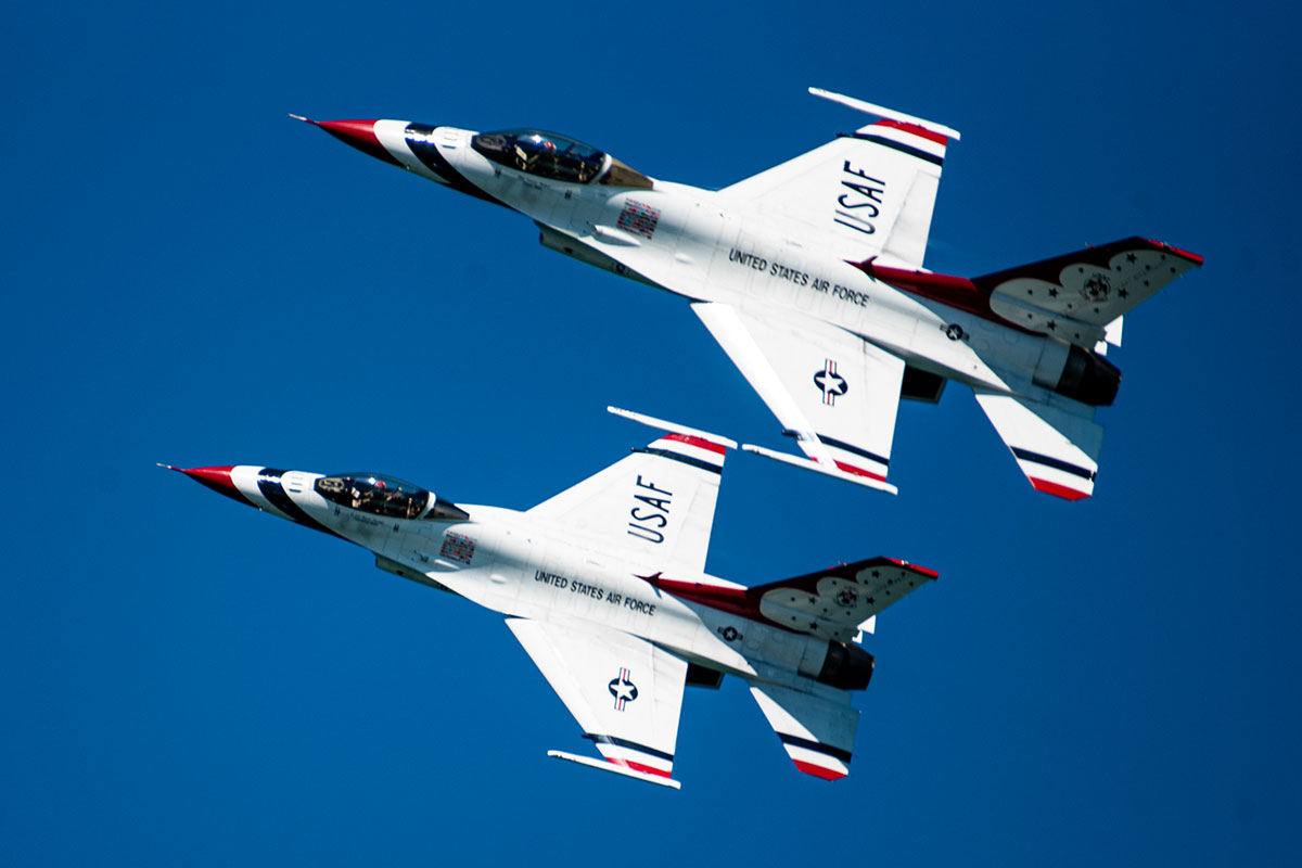 Two jets side by side wings almost touching.