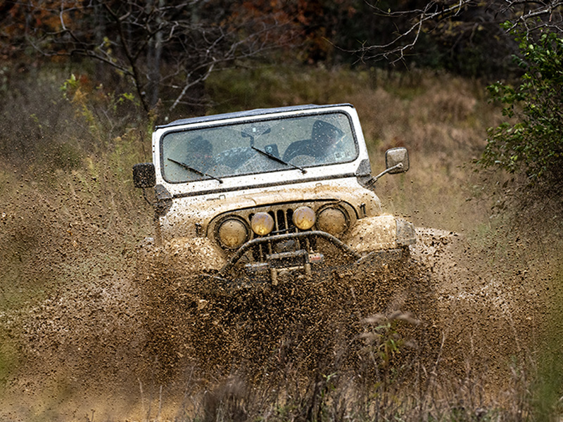 Jeep plowing through the mud